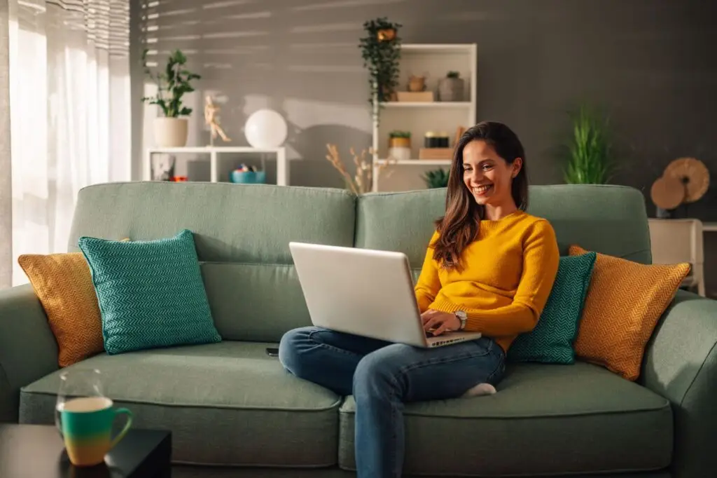 Woman comparing mortgage options on her laptop at home